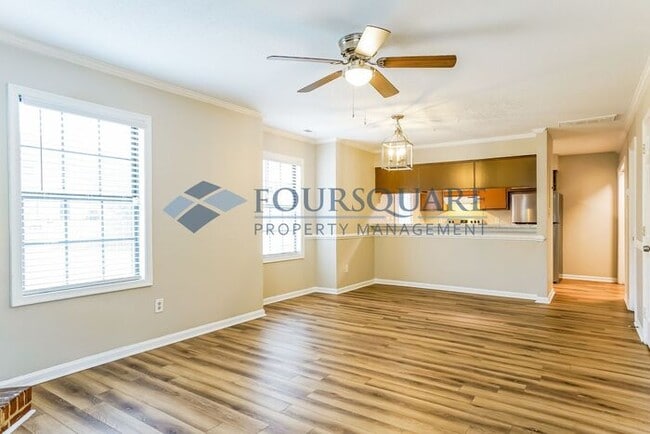 Building Photo - Inviting 2-Bed Townhome with Front Porch, Private Parking  & Storage