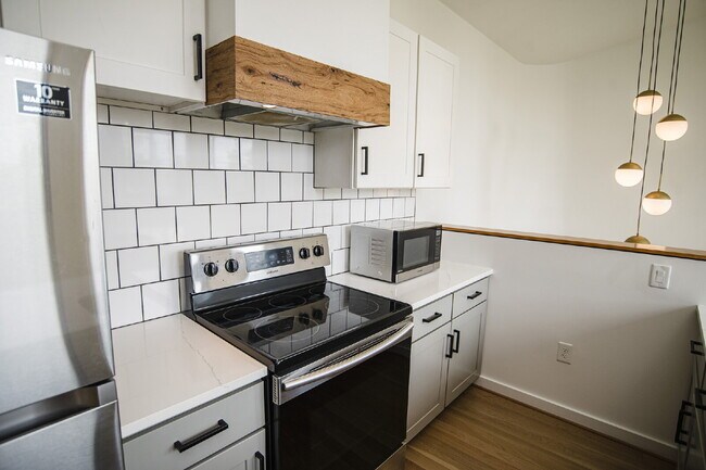 Building Photo - August Only: Submit your application this month and pay a reduced application fee of just $32. Ch...
