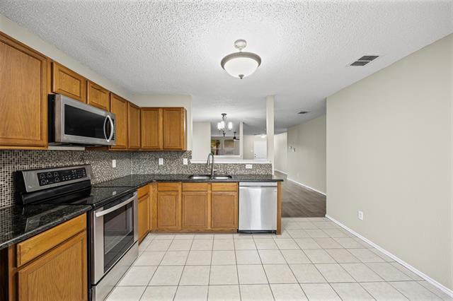 Building Photo - 8409 Redheart St