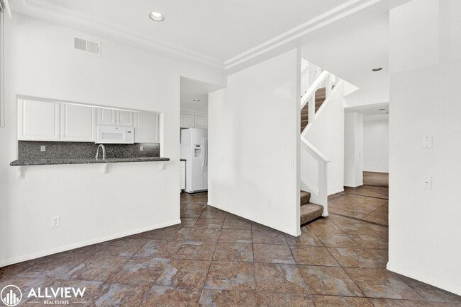 Building Photo - Spacious Coastal Condo with Rooftop Ocean ...