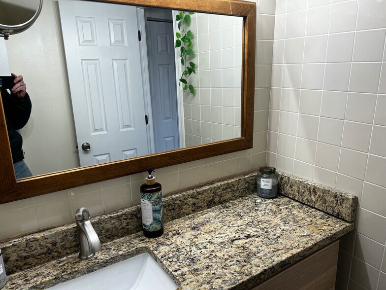 outer bathroom with sink, storage, granite counters - 1420 N St NW