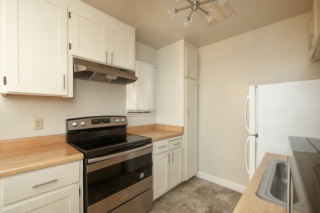 Building Photo - Peaceful Forest-View Condo with Fireplace & Private Balcony in Golden Oaks