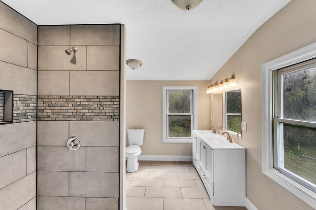 Primary Bathroom offers double sink vanity. Bathroom is larger than it appears with additional space - 2416 Magee Road Ext