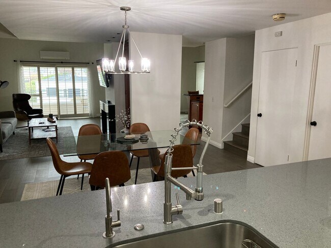 Building Photo - Beachside Furnished Retreat! Remodeled 2BD/2BA Condo Steps from the Sand!