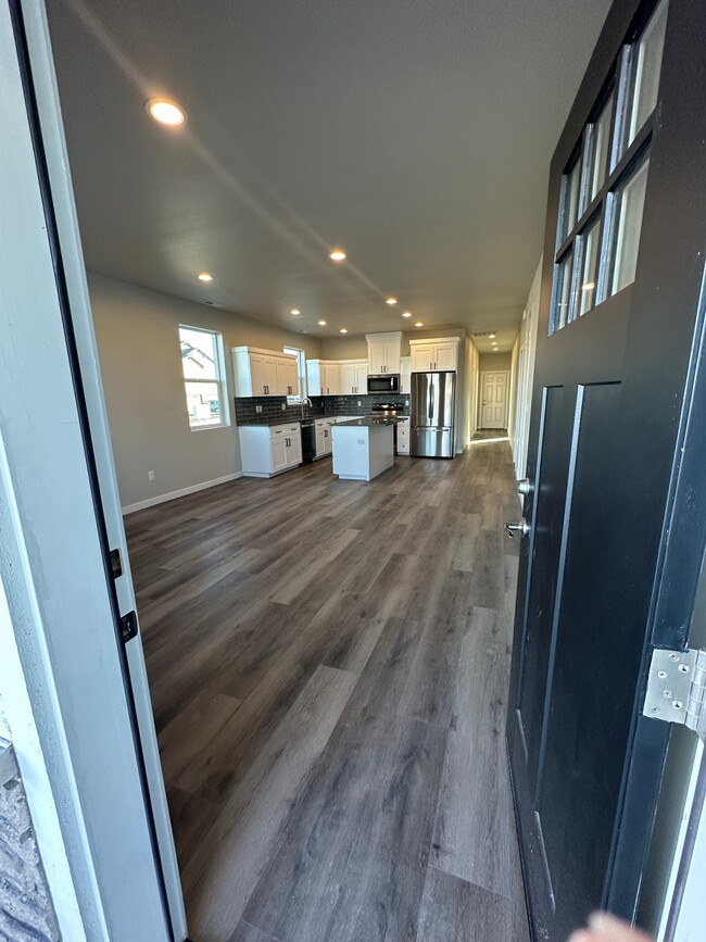 view into living room and kitchen from front entryway - 4081 Quinn Dr NE