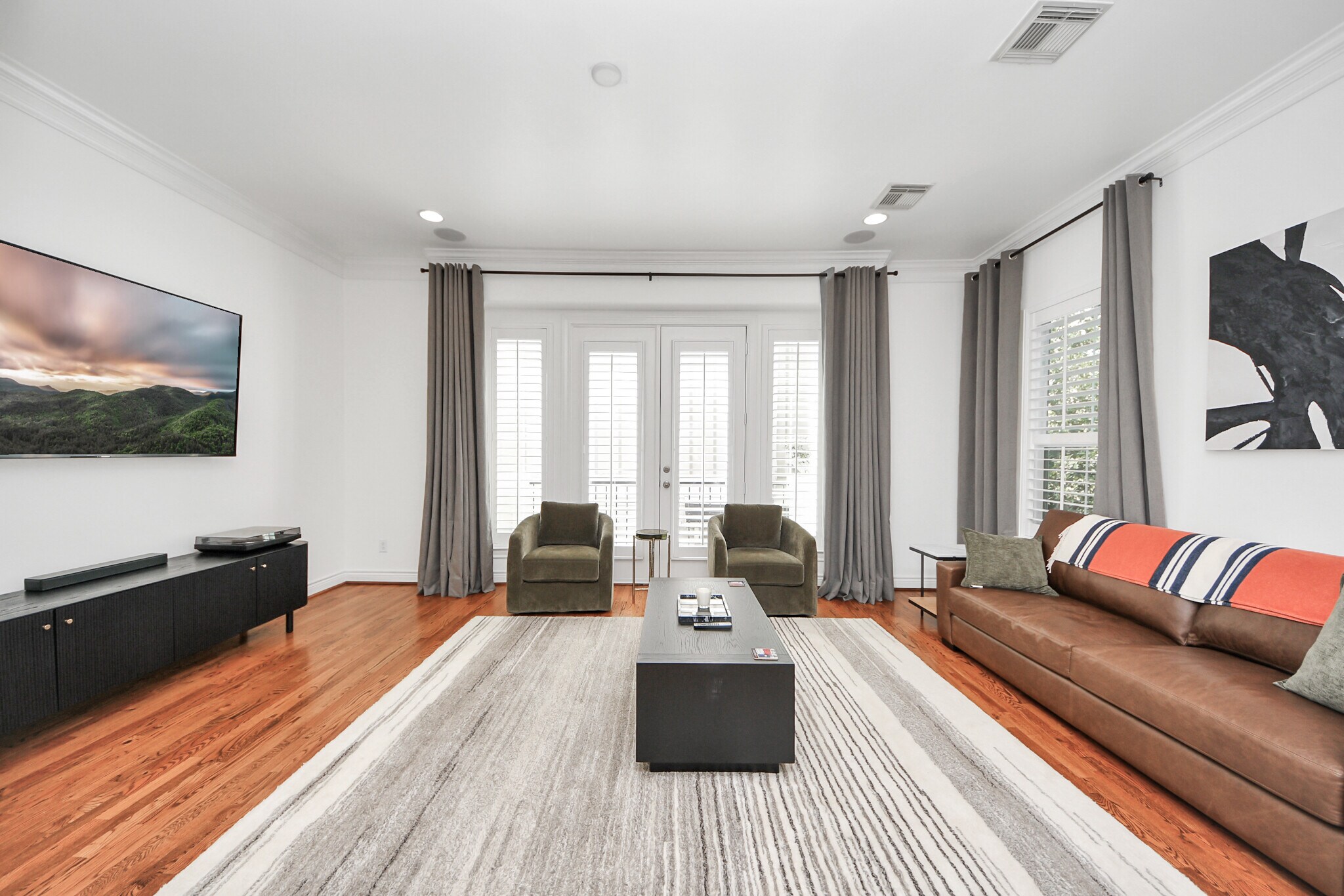An open concept connects dining, kitchen, and lounge in perfect flow. - 620 Rutland St