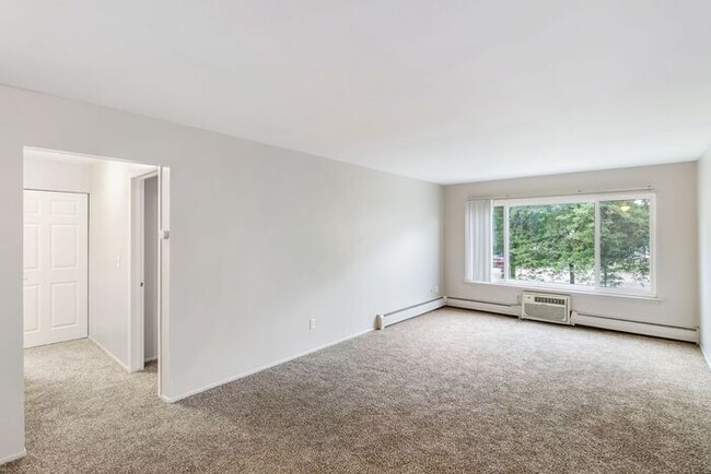 Building Photo - *Beautiful Apartment in Park Like Setting*...