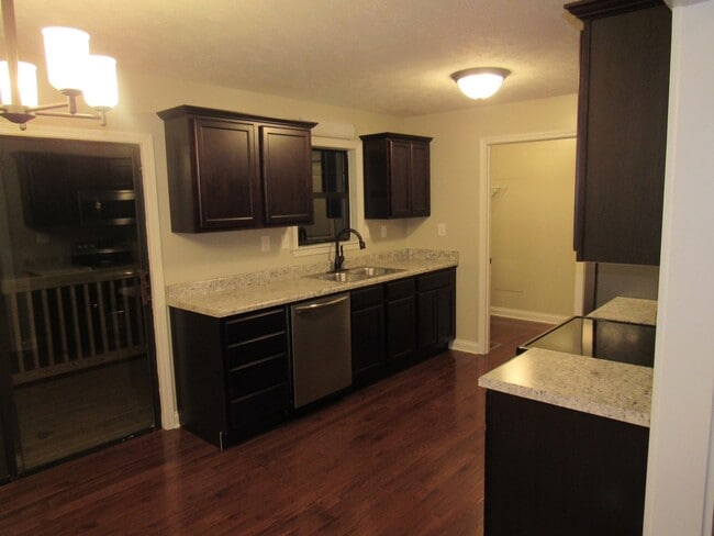 Building Photo - 4 Bedroom, 3 Bath Basement Ranch with Coun...