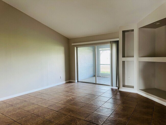 Building Photo - Experience this Cape Coral 3 bedroom 2 bath corner duplex with 1 car garage and screened in lanai.