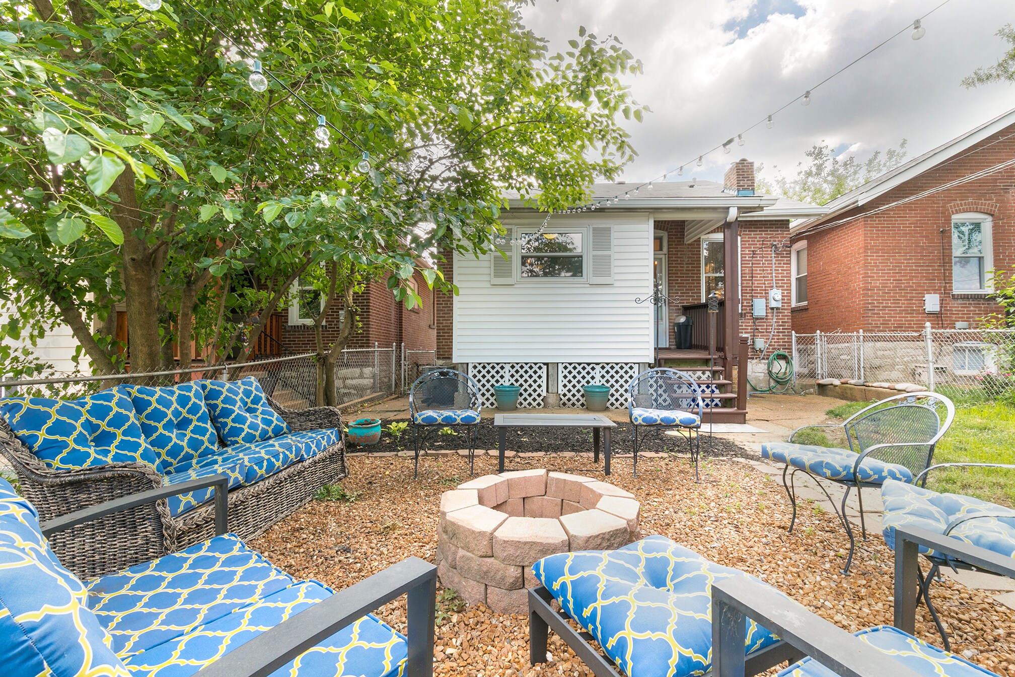 Fenced backyard with fire pit and detached garage - 4945 Delor Street