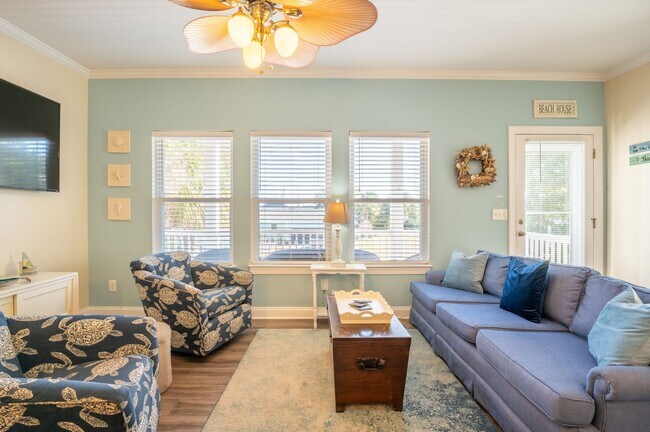 Building Photo - PRICE REDUCTION! LIVE AT THE BEACH FOR THE...