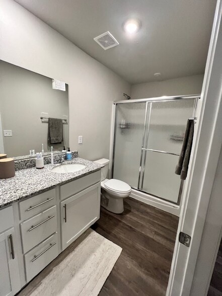 Primary bath has walk-in shower and spacious granite countertop - 2488 N Raven Ln
