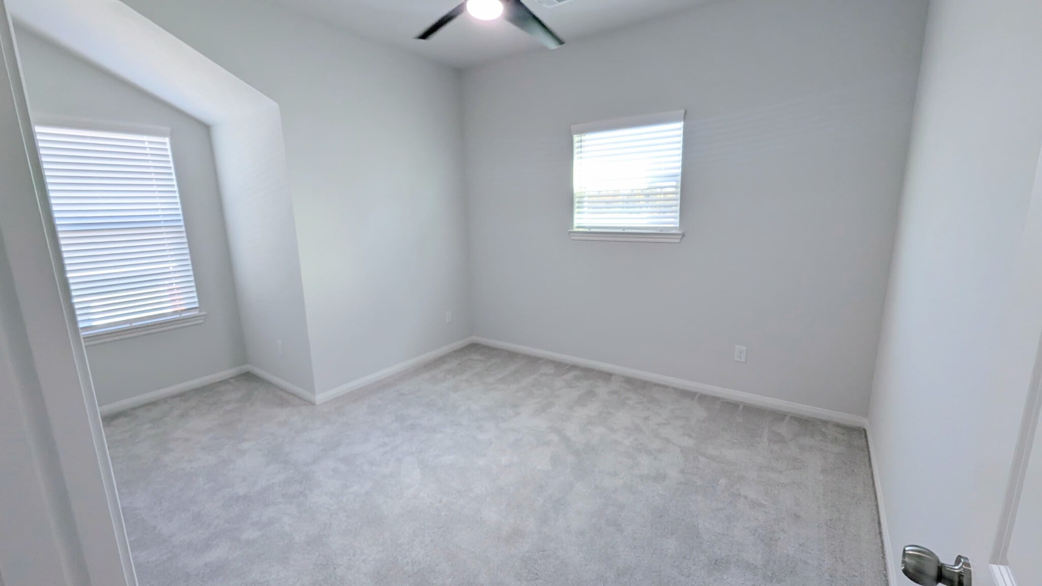Bedroom 2 upstairs has lots of natural light and a cozy cut-out. - 13218 HP Johnson St