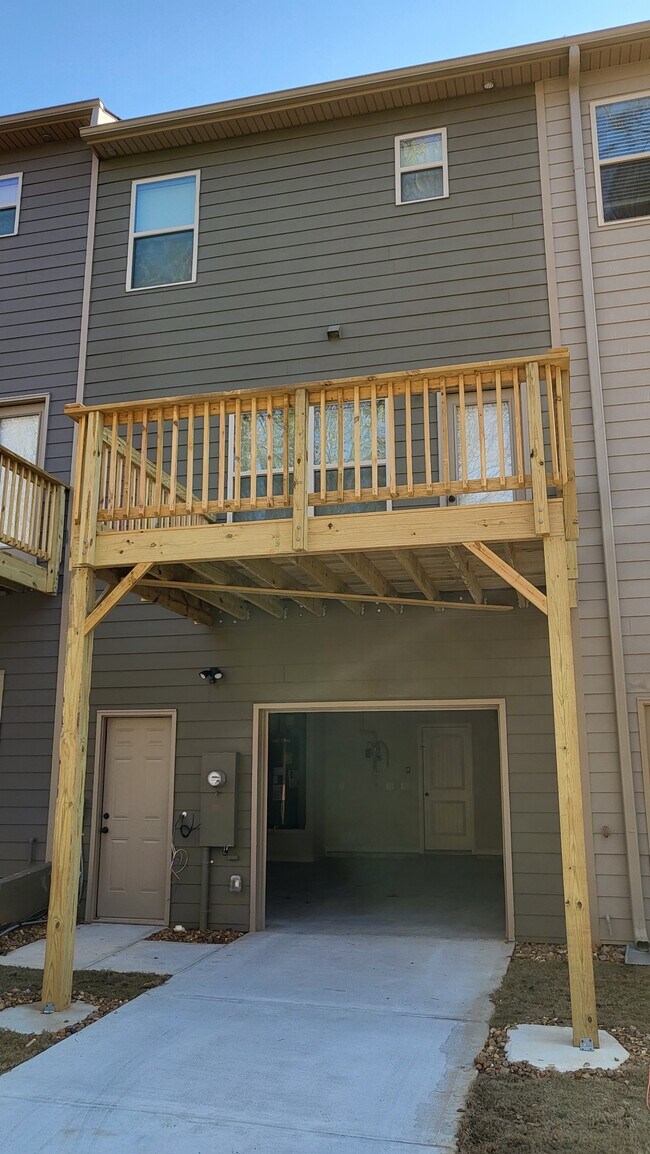 Rear of Townhome - includes Garage Door Opener and Separate Monitored Entrance. - 1373 Bayrose Cir