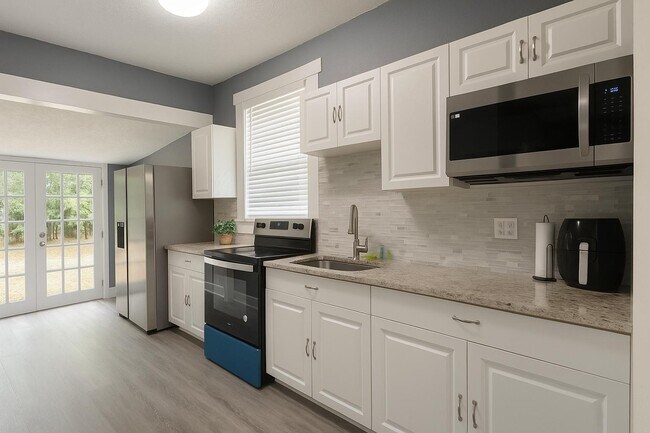 Building Photo - 1216 E 33rd Ave