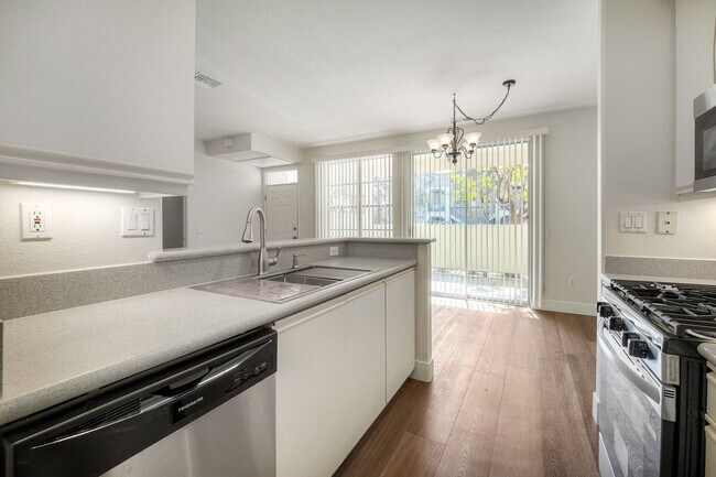 Building Photo - Coastal Living at Its Best – Upgraded 1BR Condo with Private Patio & Resort-Style Amenities