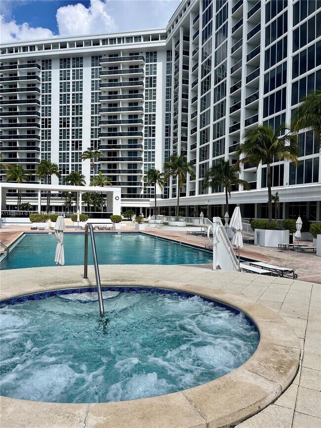 Building Photo - 10275 Collins Ave