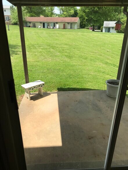 Private, shaded patio with large, open yard - 108 Oak Rd