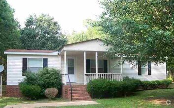 Building Photo - Large Three Bedroom, Two Bath On Wooded Lot