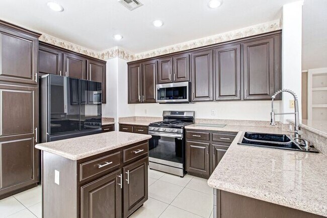 Building Photo - Spacious 4-Bedroom Home with Fireplace, 3-Car Garage & Great Backyard