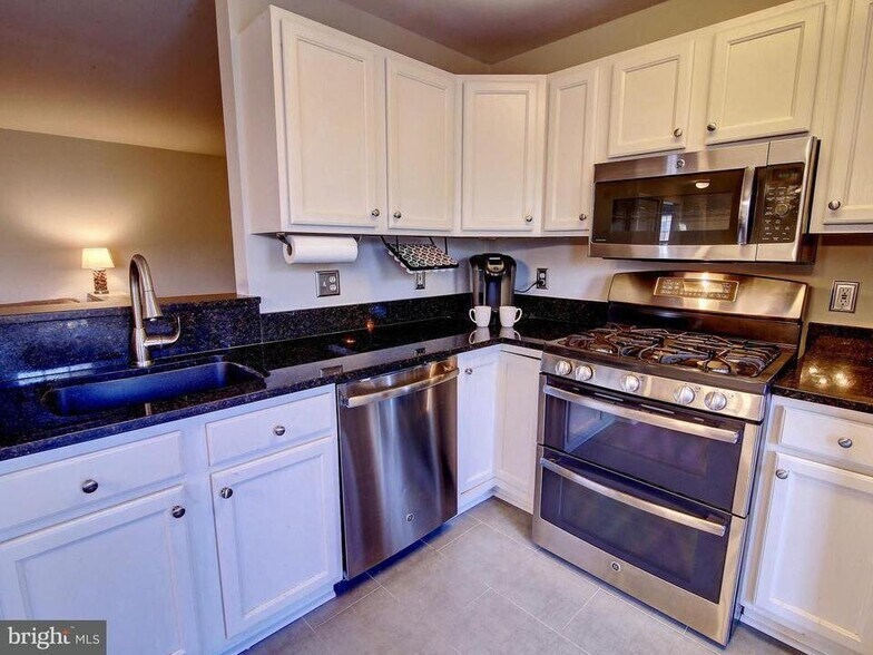Modern and upgraded kitchen with plenty of space and storage. - 501 Constellation Square SE