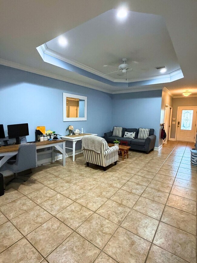 Building Photo - 3/2 with grass cutting included & access to community amenities.