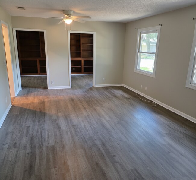 Building Photo - Corner Lot Charm: Spacious 4 Bed on Corner Lot w/ Custom Bookshelves & Private Storage Shed