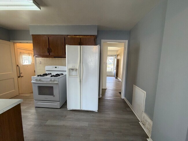 Building Photo - Bright Cape w/ Sunroom, Central Air, Big Basement & Backyard Shed