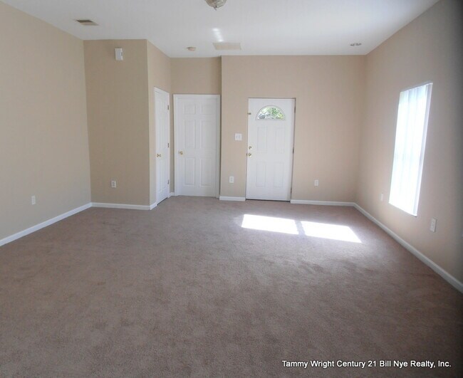 Building Photo - THREE BEDROOMS AND A TWO CAR GARAGE