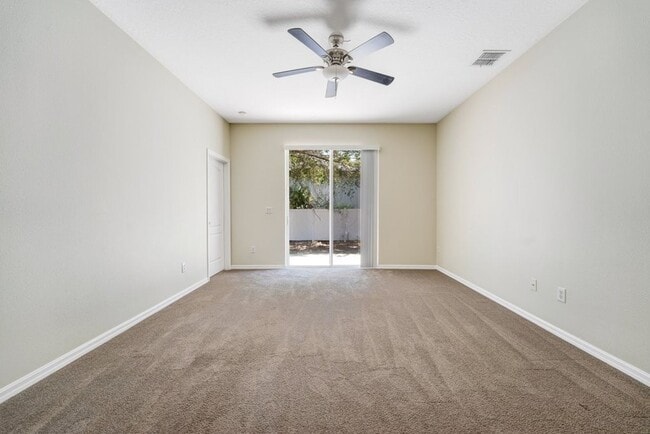 Building Photo - Cozy 4/2 Home Nestled in a Gated Community