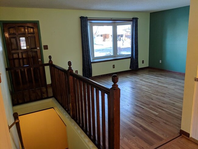 front door and bay window overlooking flower gardens - 28 James Circle