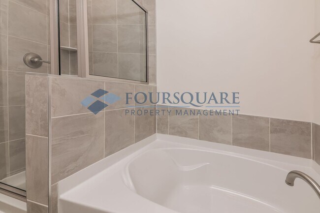 Building Photo - Charming End Unit Townhome With Back Patio...