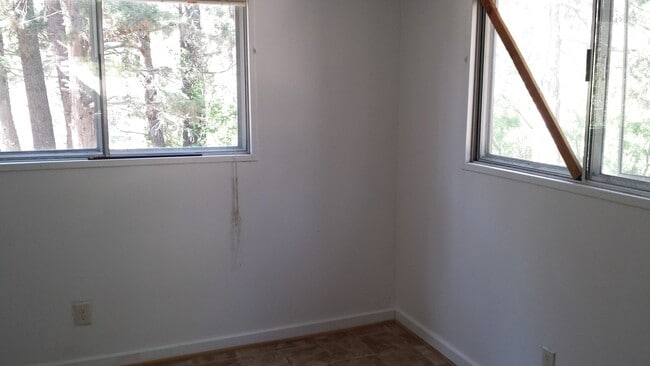 Building Photo - Rustic three bedroom with large lot.