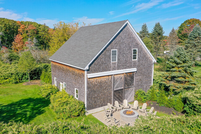 Fantastic 60" propane fire pit with 14 Plywood brand Adirondack Chairs. - 96 Spurwink Rd