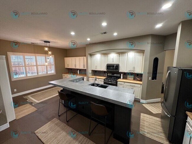 Building Photo - Open Kitchen, Expansive Living, and Covered Patio in Tranquil South Reno Near Trails, Parks & Sho...