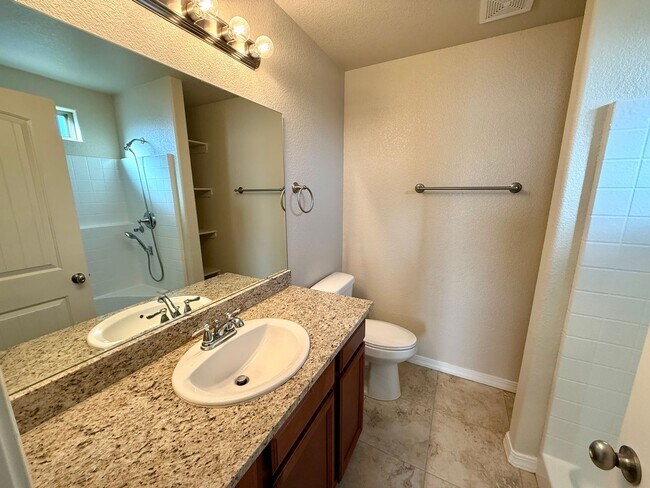 Building Photo - Great 4 Bedroom Home with Drive Through Side Gate!