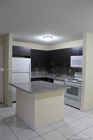 Building Photo - 4680 NW 102nd Ave  104-20