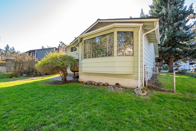 Building Photo - Spacious 4-Bedroom Home with Fireplace, Fenced Yard, and 2-Car Garage