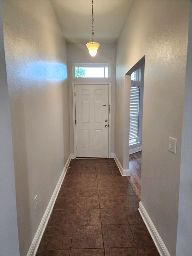 Building Photo - Welcome to your 4/2 dream home in Pace Mil...