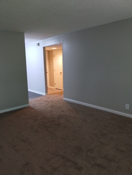 The spacious living room features carpet,z - 441 Harding Pl