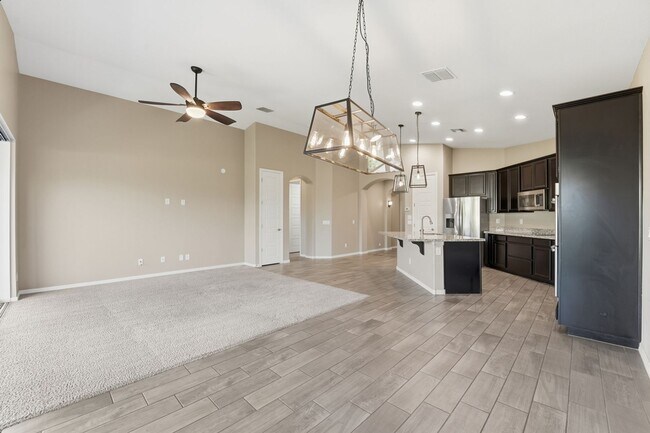 Building Photo - Stunning 4-Bed + Den Eastmark Home with Modern Upgrades Throughout