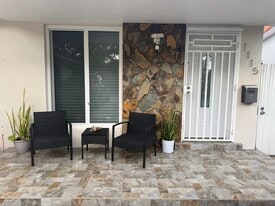 Front part of the house with a private gated entrance to backyard - 1115 NW 32nd Ave