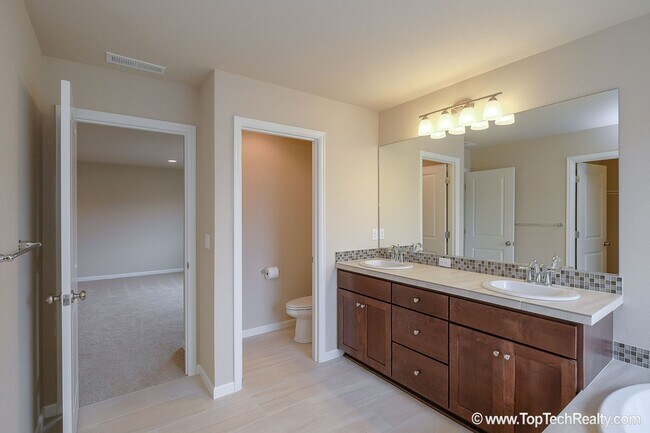 Building Photo - Spacious 4-Bedroom + Office Home in Abbey Creek – Modern Finishes, EV Charger & Low-Maintenance B...