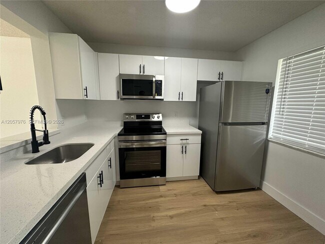 Building Photo - 8560 N Sherman Cir