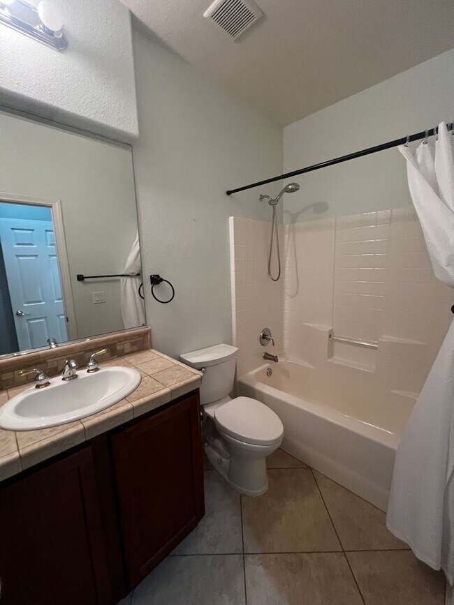 Building Photo - Spacious 4-Bedroom Mountains Edge Home with Downstairs Suite, Balcony & Covered Patio