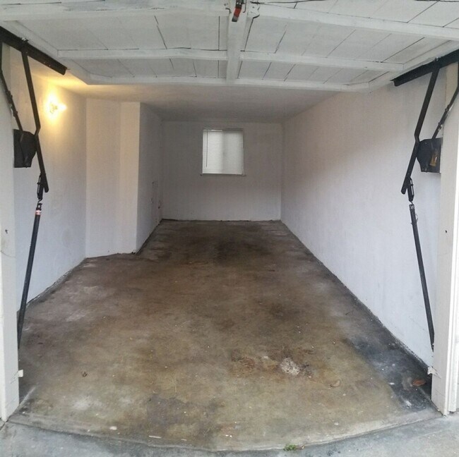 Building Photo - Renovated 1-Bedroom with Garage Parking & Garbage Paid!