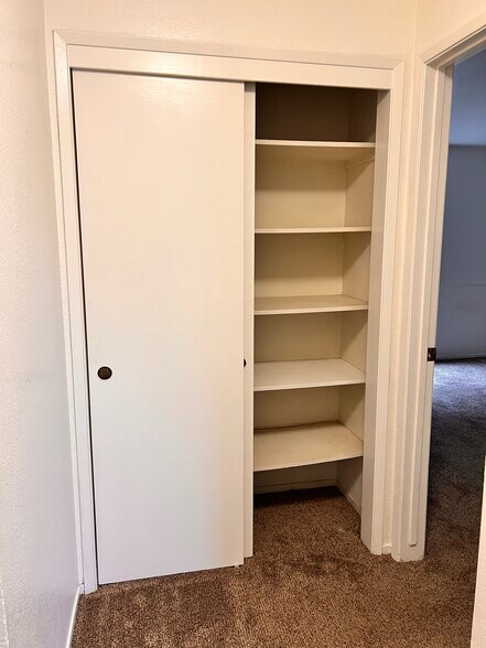 Hall closet storage - 9012 Cornwall Dr