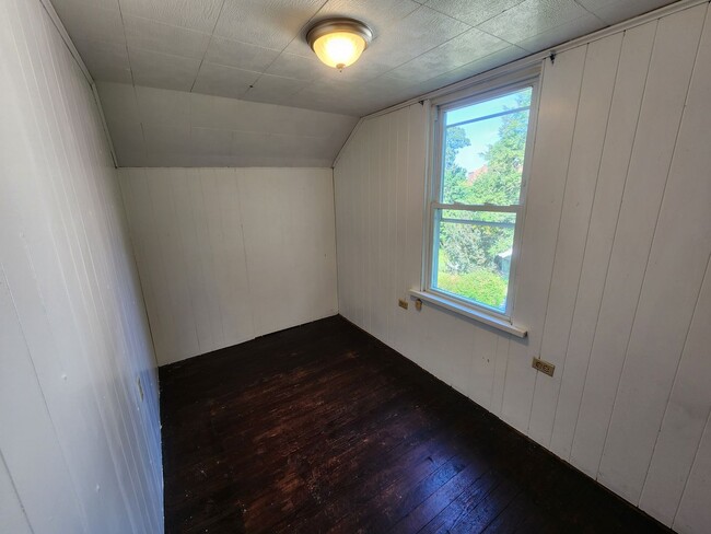 Building Photo - 4 BR home with first-floor living, new roof, and a private-feeling backyard in Lincoln Place