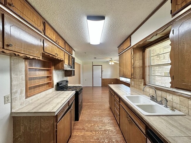 Building Photo - Spacious 4-Bedroom Home on a Corner Lot wi...