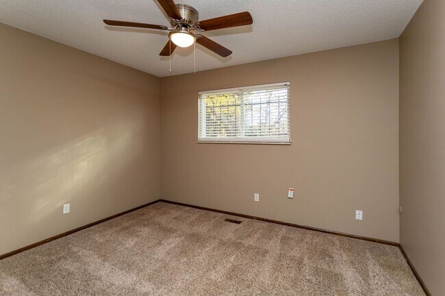 Building Photo - Comfortable Ranch-Style Living with Large Fenced Backyard!